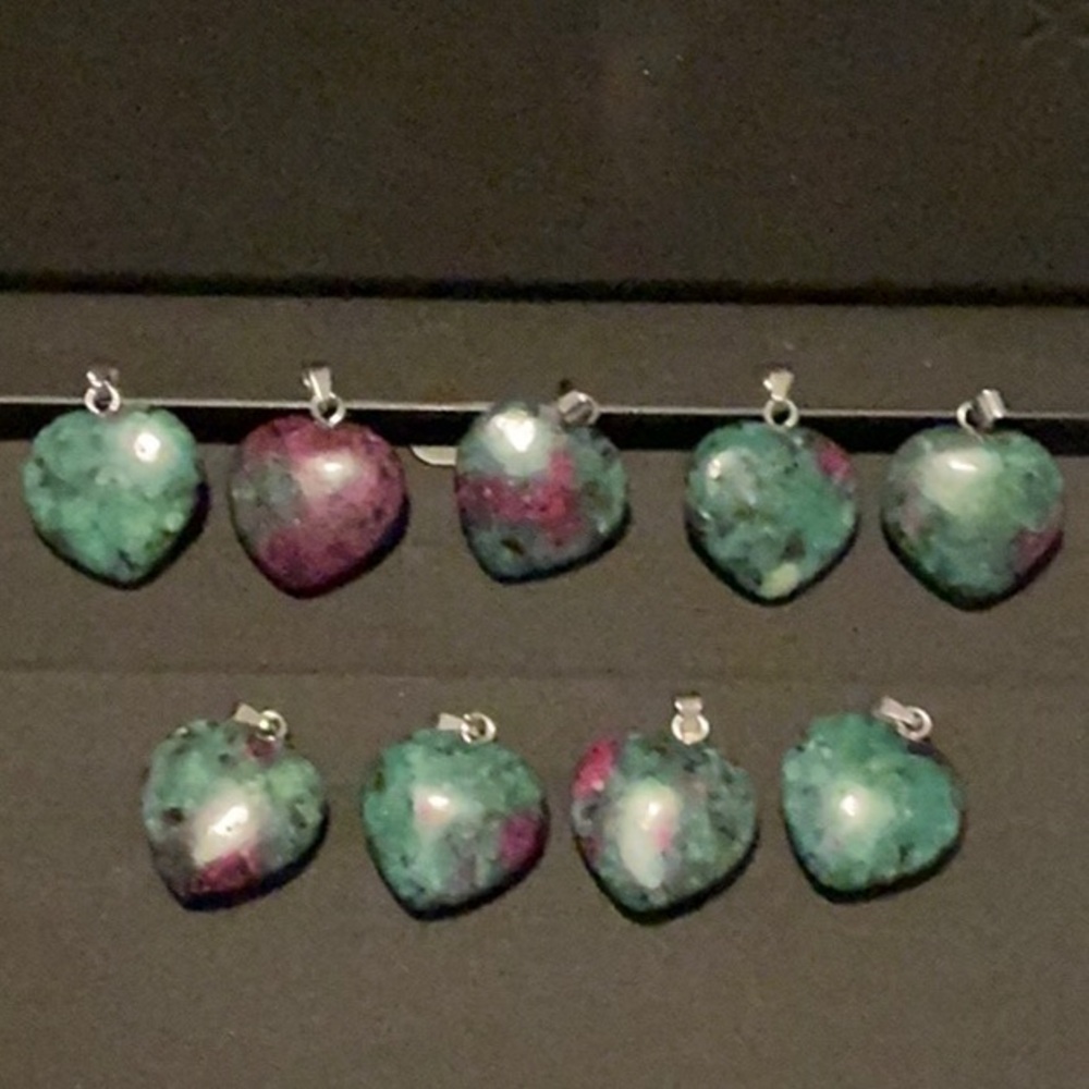 Natural crystal heart pendant.